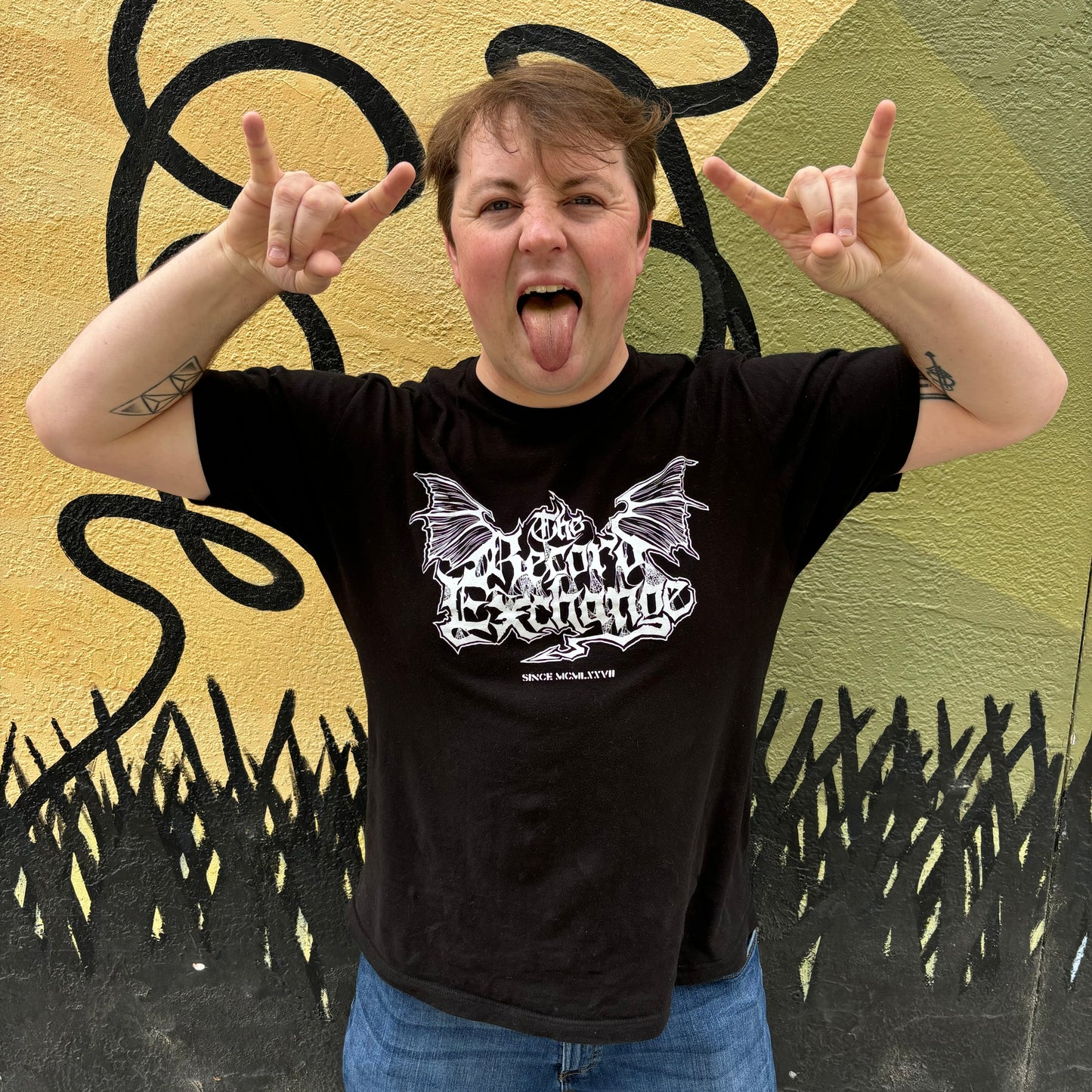 Death Metal model posing with Heavy Metal Logo on Black T-Shirt. Branding from The Record Exchange Boise Idaho.